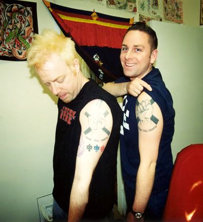 Dave Smalley and Tim DCXX comparing tattoos, Photo: Traci McMahon