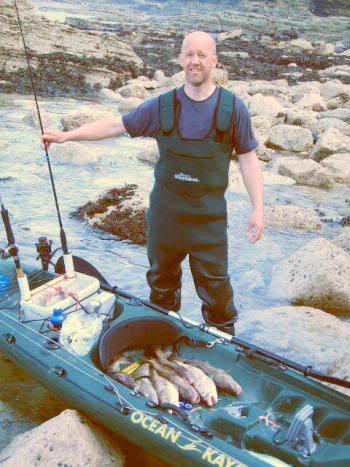 ian sellors catching bass from his kayak - ocean prowler ian sellors catching bass from his kayak - ocean prowler
